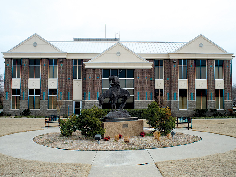 a statue in front of city hall