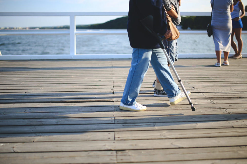 a man walking with a cane